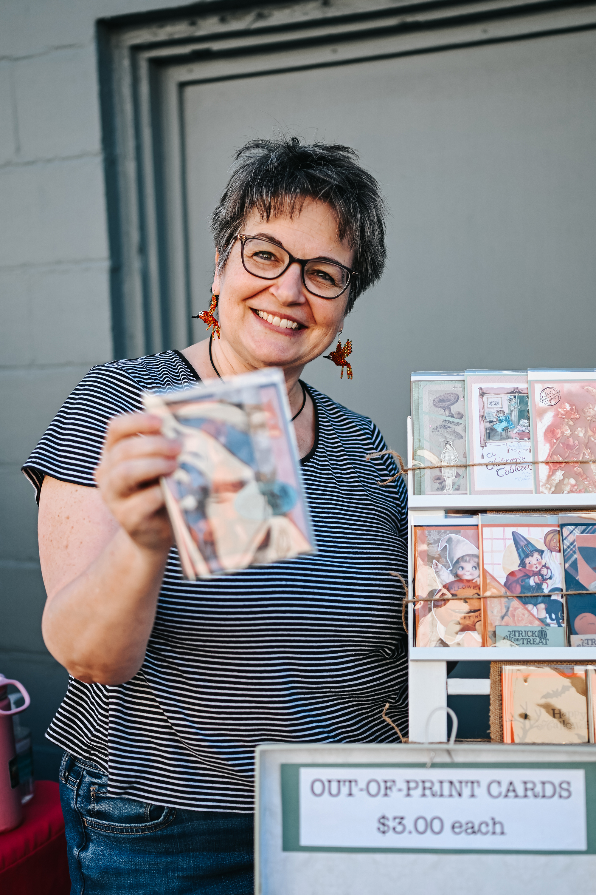 Michelle holding a greeting card